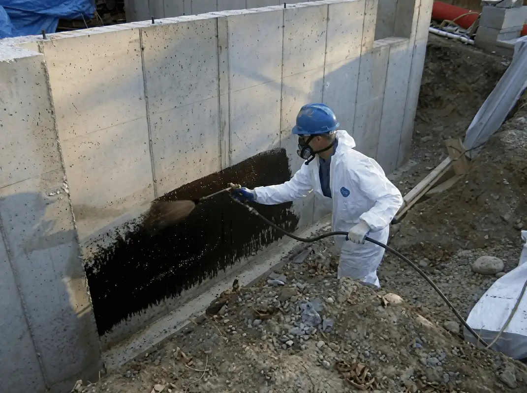 Professional waterproofing the exterior walls of the basement in Detroit, MI
