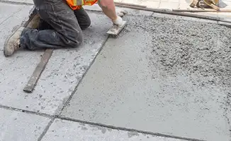 Professional repairing a concrete floor in Detroit, MI